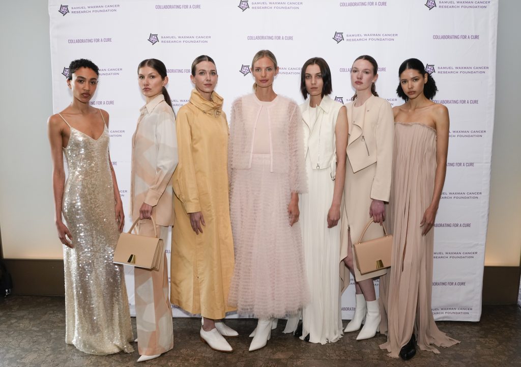 Models wearing Akris attends The Waxman Luncheon 